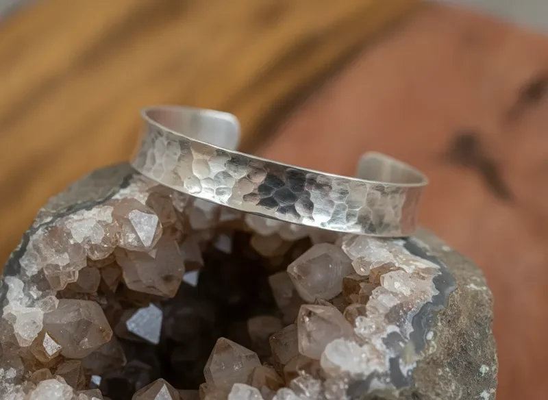 Textured silver cuff bracelet on raw geode crystal